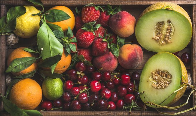 #healthy summer fruit variety healthy summer fruit variety melon sweet cherries peach strawberry orange and lemon on wooden tray background top view horizontal composition
